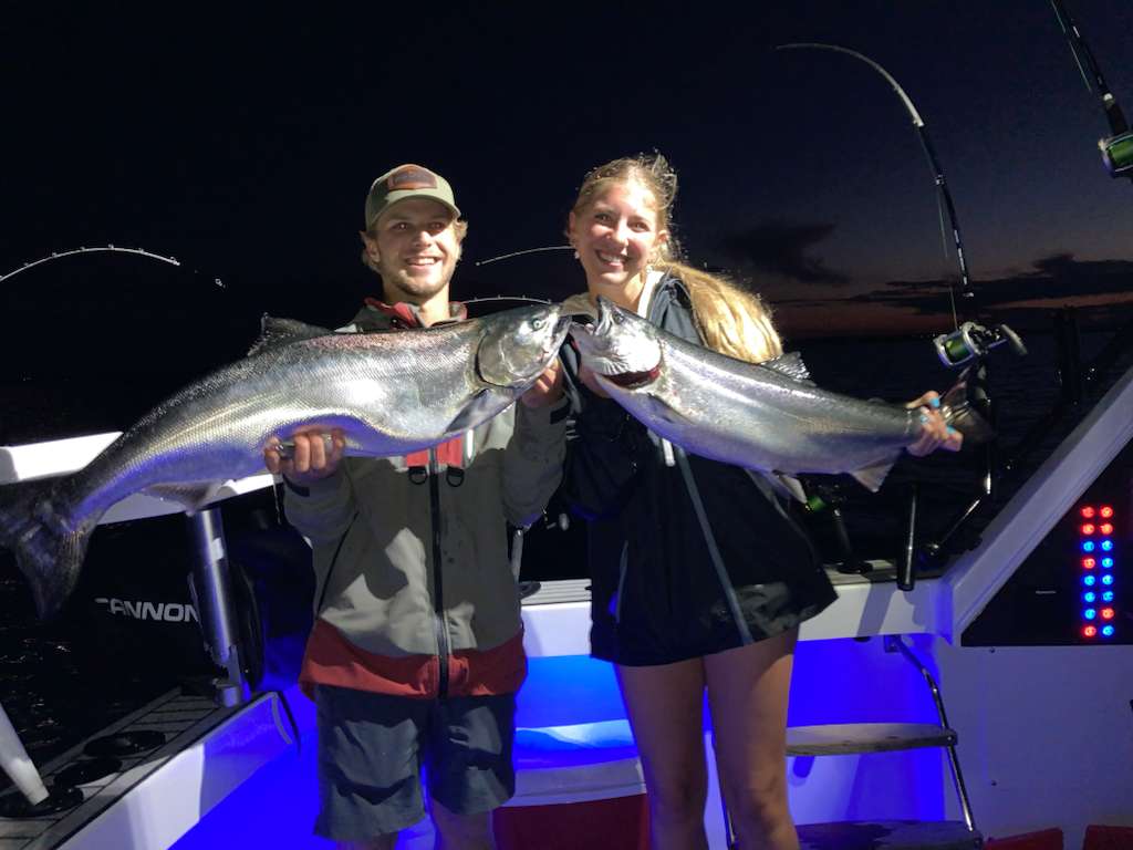 Night fishing couple with catch